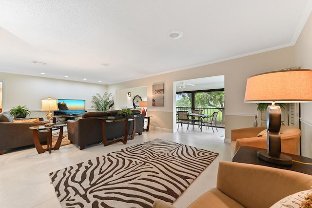 living room with crown molding and light tile patterned flooring