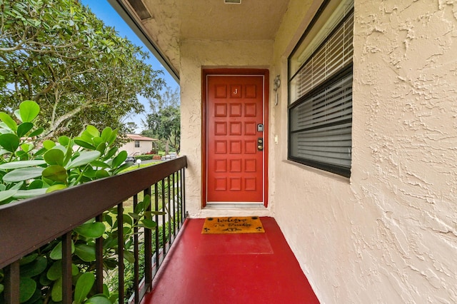 property entrance with a balcony