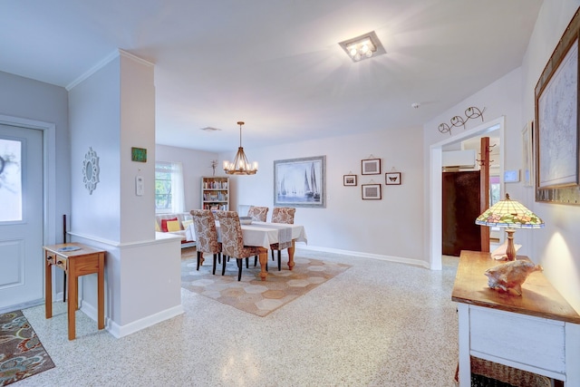 dining area with a notable chandelier