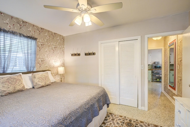 bedroom featuring ceiling fan and a closet