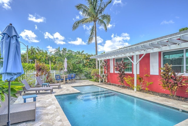 view of swimming pool with a patio area and a pergola