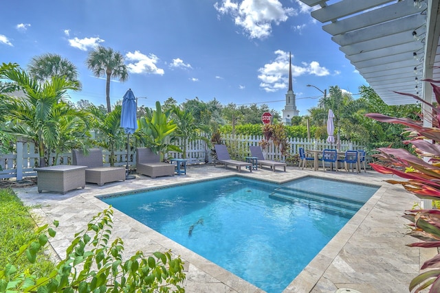 view of pool featuring outdoor lounge area, a patio area, and a pergola