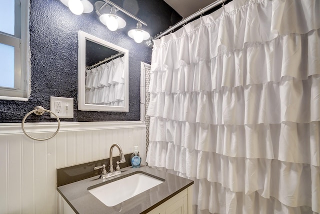 bathroom with vanity and walk in shower