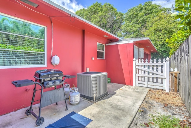 view of patio with central air condition unit and area for grilling