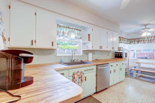 kitchen featuring sink, stainless steel dishwasher, white cabinetry, and ceiling fan