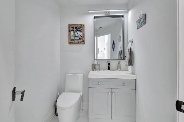 bathroom with toilet and vanity