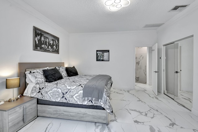 bedroom featuring crown molding, a textured ceiling, a closet, and ensuite bathroom