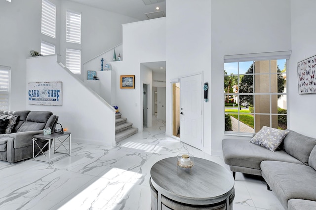 living room with a towering ceiling