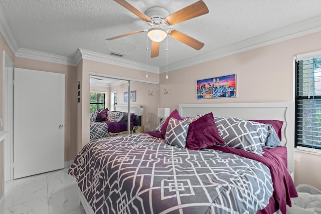 bedroom with crown molding, a textured ceiling, a closet, and ceiling fan