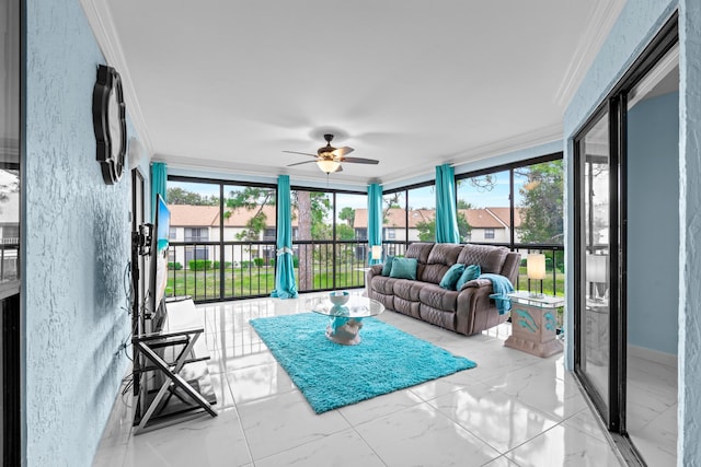 sunroom / solarium with a healthy amount of sunlight and ceiling fan