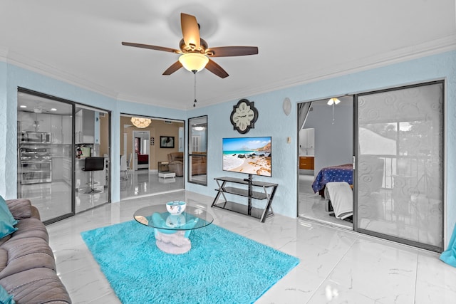 living room featuring ceiling fan and crown molding