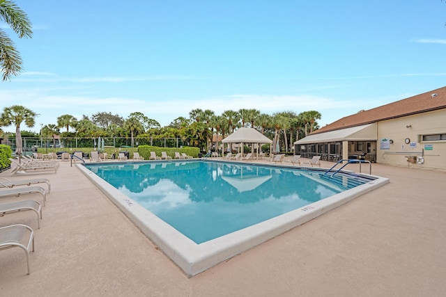 view of swimming pool with a gazebo and a patio