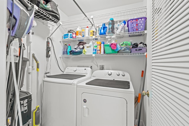 clothes washing area with washer and dryer