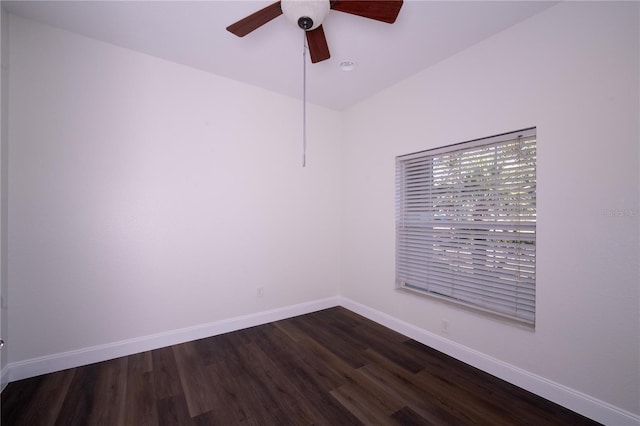 spare room featuring ceiling fan and dark hardwood / wood-style flooring