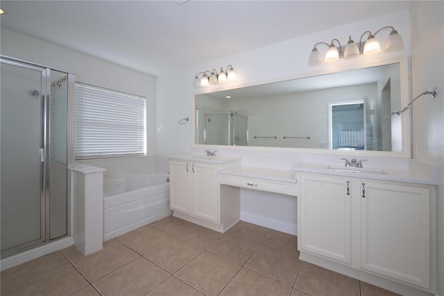 bathroom featuring plus walk in shower, tile patterned floors, and vanity