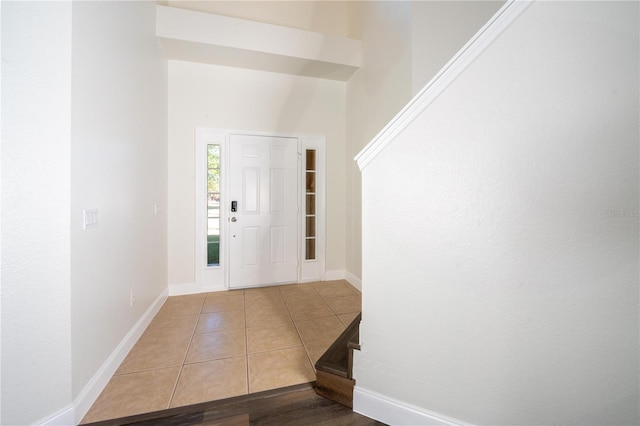 entrance foyer with light tile patterned floors