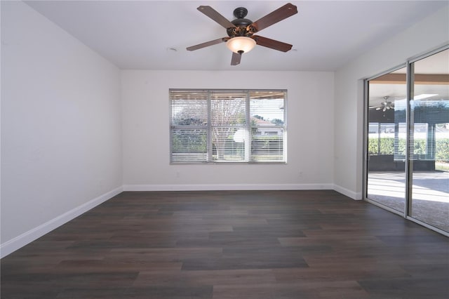 empty room with ceiling fan, a healthy amount of sunlight, and dark hardwood / wood-style floors