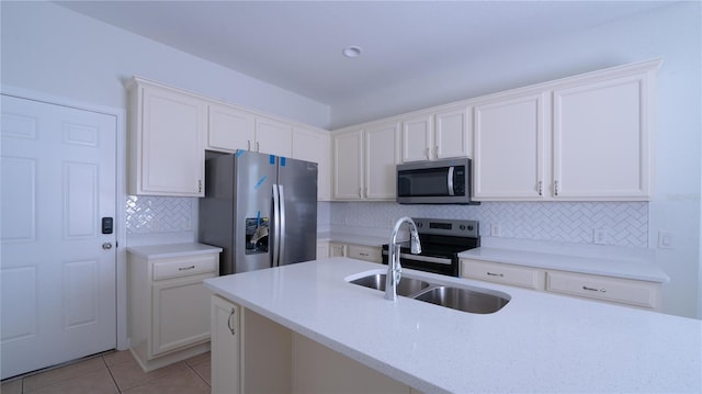 kitchen featuring appliances with stainless steel finishes, sink, and white cabinets