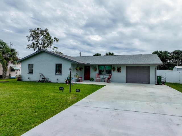 single story home featuring a garage and a front lawn