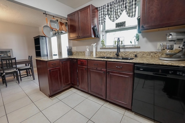 kitchen featuring light stone counters, black dishwasher, sink, and kitchen peninsula