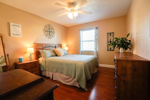 bedroom with dark hardwood / wood-style flooring, a textured ceiling, and ceiling fan