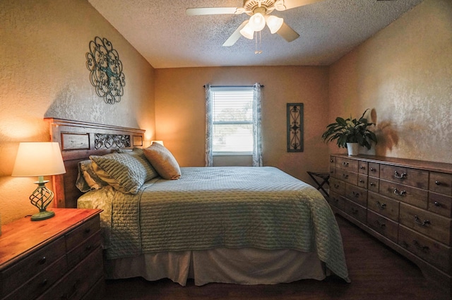 bedroom with ceiling fan and a textured ceiling