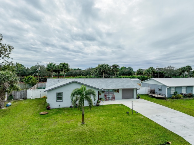 single story home with a garage and a front yard