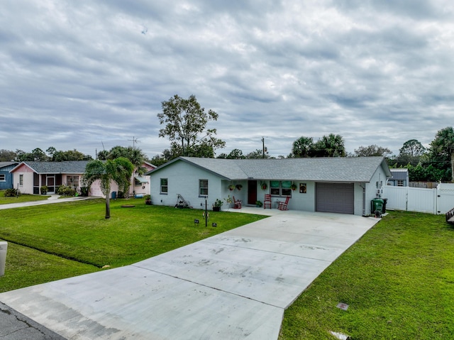 ranch-style home with a garage and a front yard