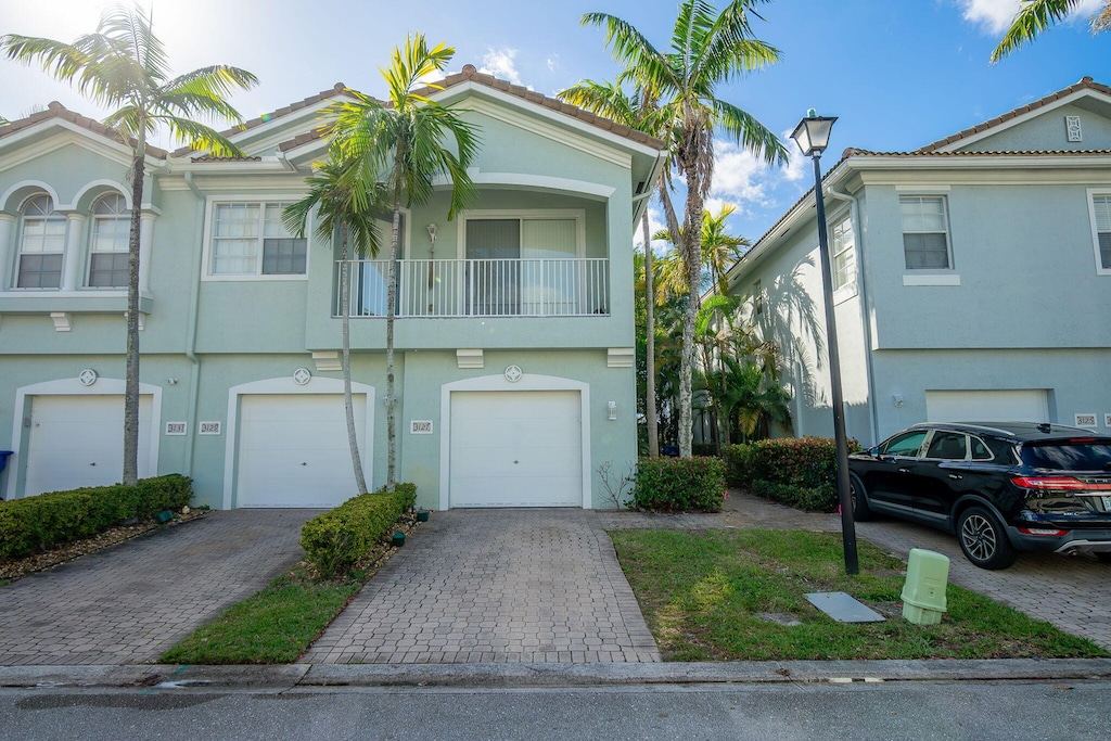 multi unit property featuring a balcony