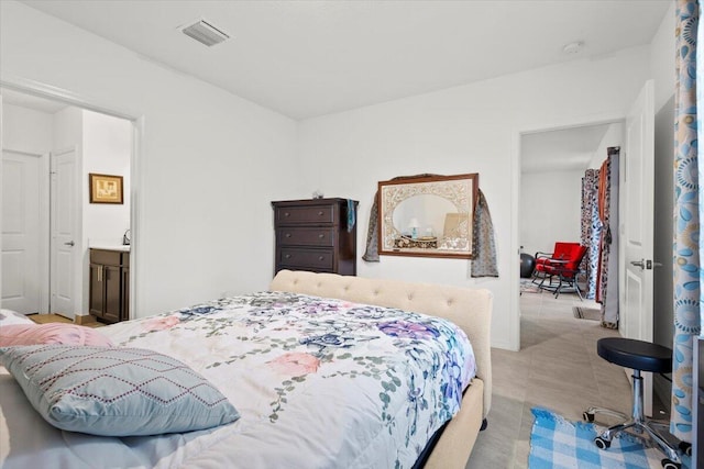 bedroom featuring light tile patterned floors and visible vents