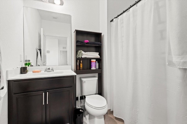 full bath featuring toilet, a shower with shower curtain, and vanity