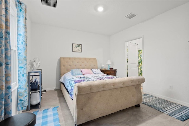 bedroom featuring visible vents and baseboards