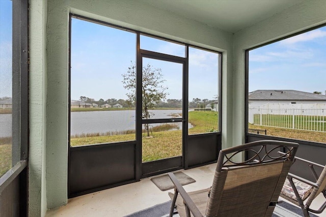 sunroom with a water view