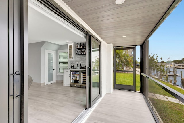 sunroom with a water view