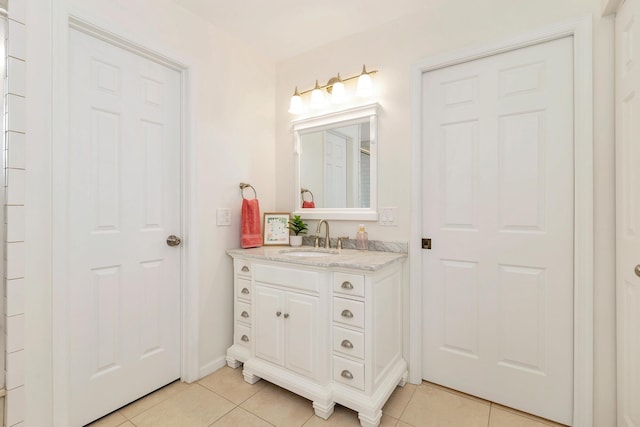 bathroom with vanity and tile patterned flooring