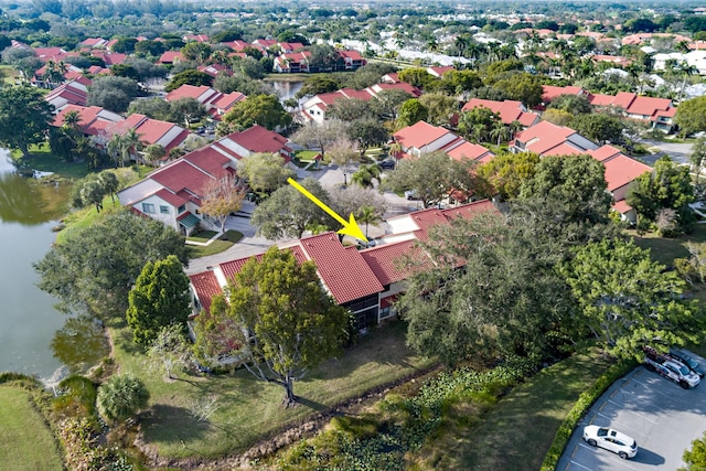 birds eye view of property featuring a water view