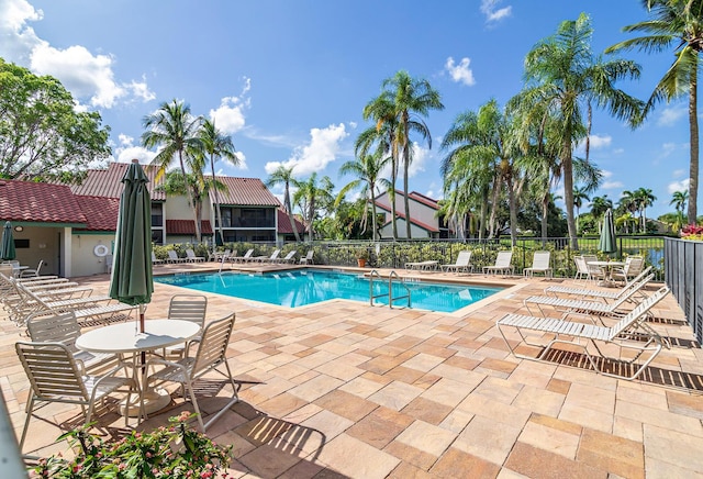 view of swimming pool with a patio area