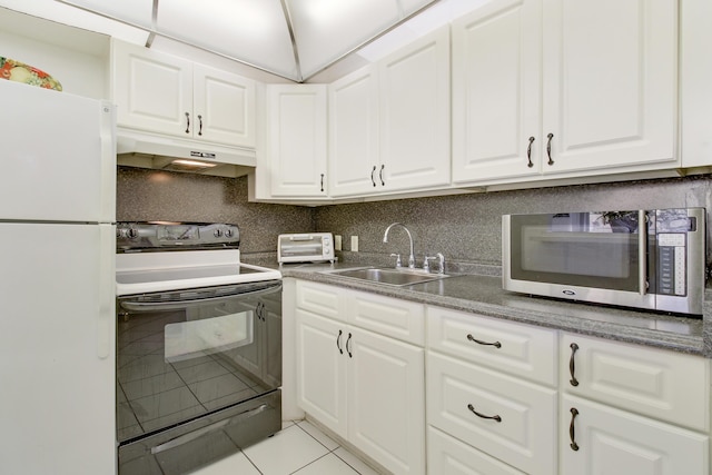 kitchen with light tile patterned flooring, sink, white cabinets, white refrigerator, and electric range