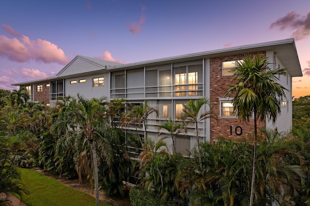 view of outdoor building at dusk