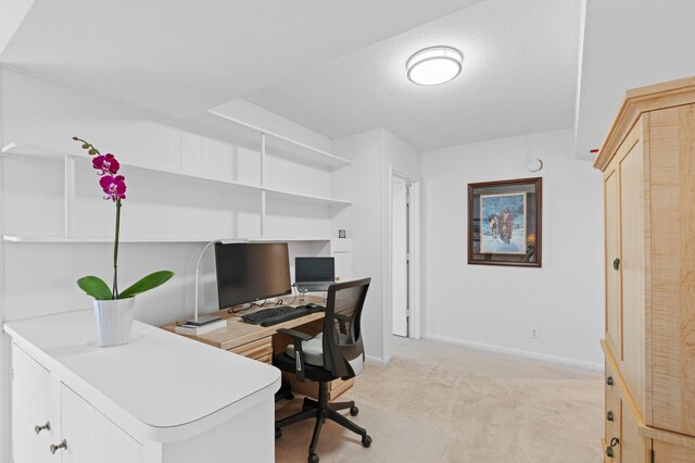 dining space featuring light carpet