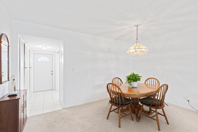 kitchen featuring decorative backsplash, light tile patterned floors, ceiling fan, a tray ceiling, and white appliances