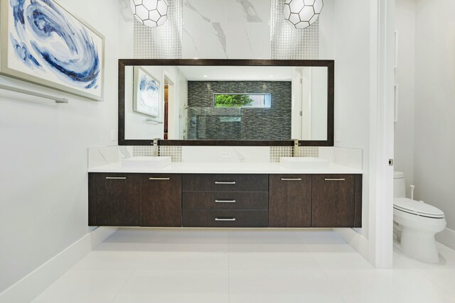 5525 Renoir Pl, Palm Beach Gardens, FL 33418 - full bathroom featuring double vanity, toilet, and a sink