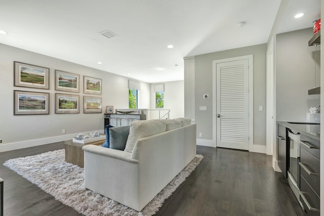 living room with dark hardwood / wood-style flooring