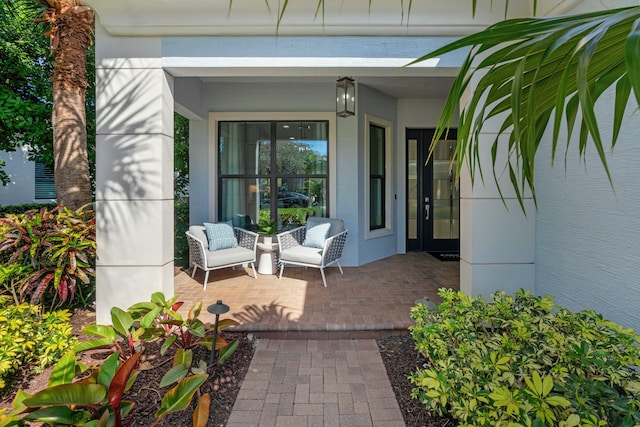 entrance to property featuring a patio