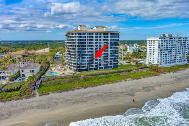 aerial view featuring a water view and a view of the beach