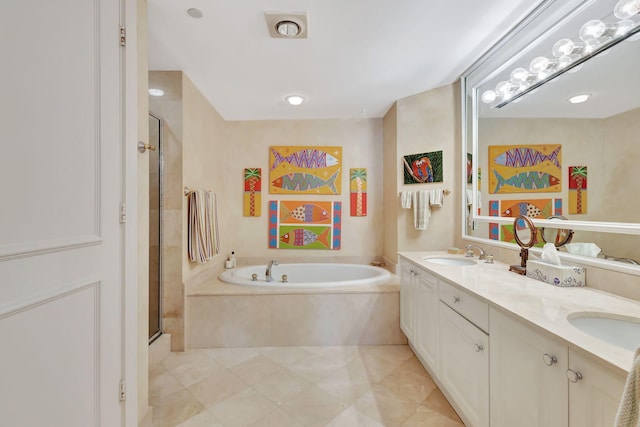 bathroom with vanity, shower with separate bathtub, and tile patterned flooring