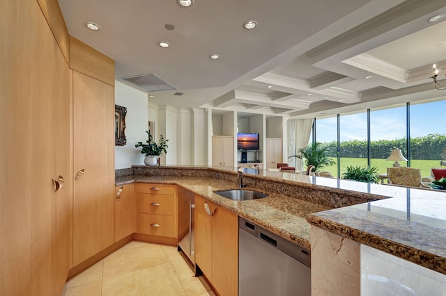 kitchen with sink, dishwasher, stone counters, beam ceiling, and coffered ceiling