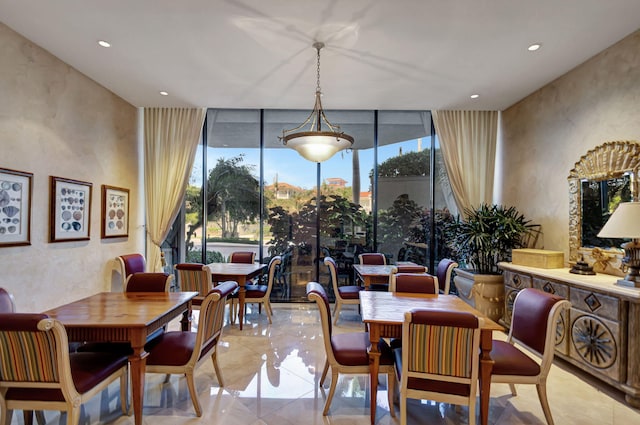 dining room featuring expansive windows and plenty of natural light