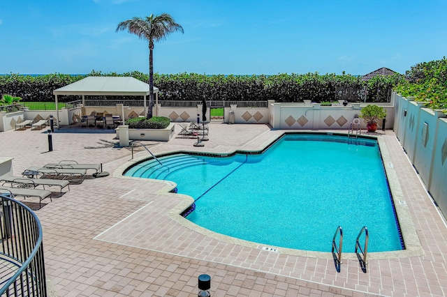 view of pool with a gazebo and a patio