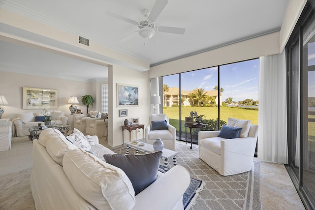 living room featuring ornamental molding and ceiling fan